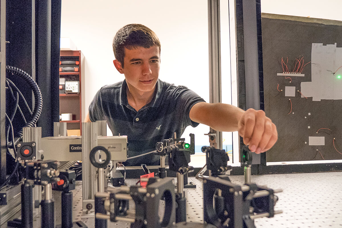 Student aligns piece of equipment before test